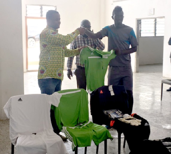 Nana Kweku Nduom (left) presenting a jersey to Charles McCarthy, skipper of Elmina Sharks